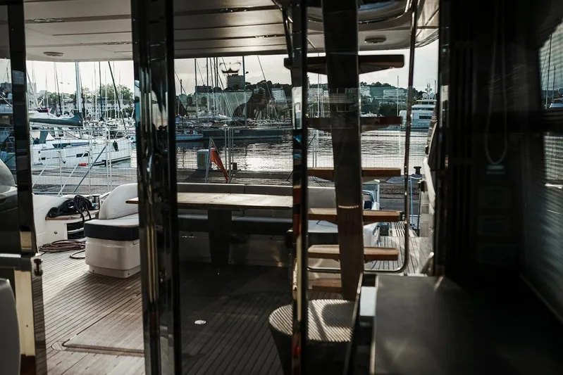  Yacht Photos Pics Luxurious 2014 Princess S72 yacht interior with marina view through glass doors.