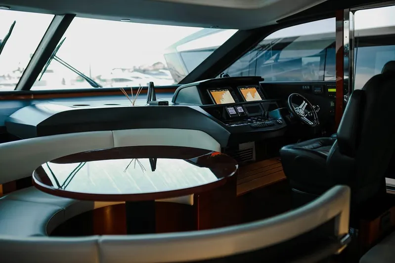  Yacht Photos Pics Luxurious interior of a 2014 Princess S72 yacht with modern helm and seating area.