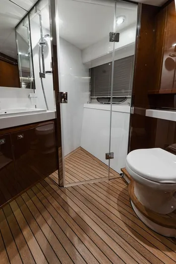  Yacht Photos Pics Luxurious bathroom on 2014 Princess S72 yacht with wood flooring and modern fixtures.