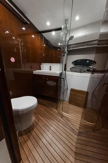  Yacht Photos Pics Luxurious bathroom in 2014 Princess S72 yacht with wooden flooring and modern fixtures.