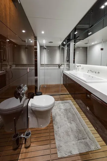  Yacht Photos Pics Luxurious bathroom in 2014 Princess S72 yacht with modern fixtures and wooden flooring.