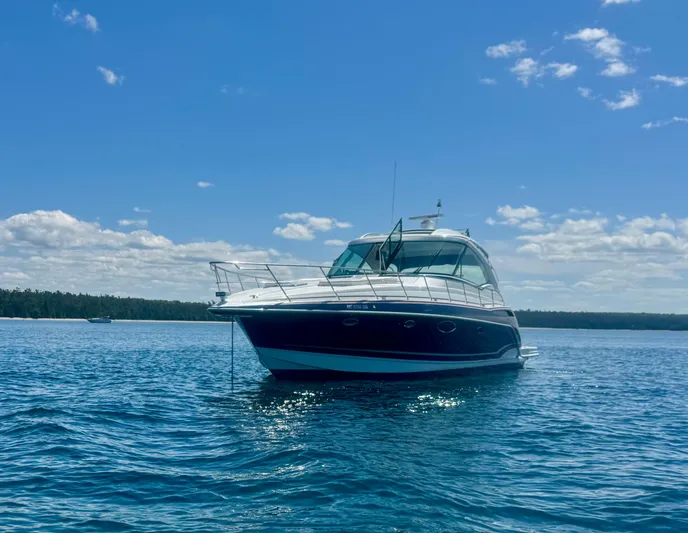 Our Seabatical Yacht Photos Pics 2014 Formula 45 Yacht on calm blue water under a clear sky.