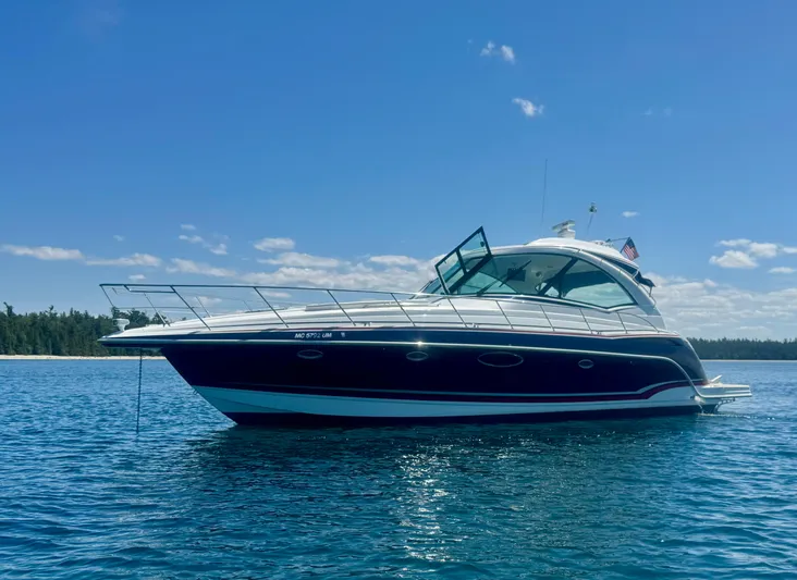 Our Seabatical Yacht Photos Pics 2014 Formula 45 Yacht on serene blue water under clear sky.