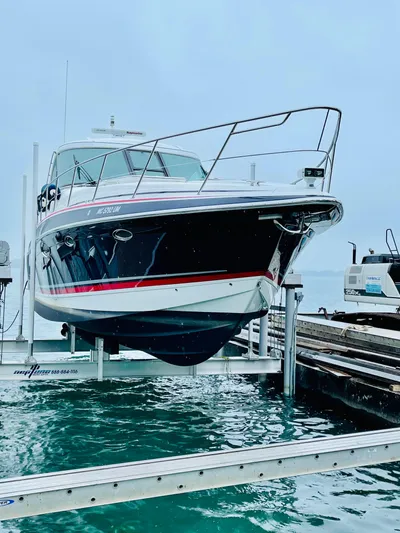Our Seabatical Yacht Photos Pics 2014 Formula 45 Yacht on lift at marina, showcasing sleek design and vibrant colors.