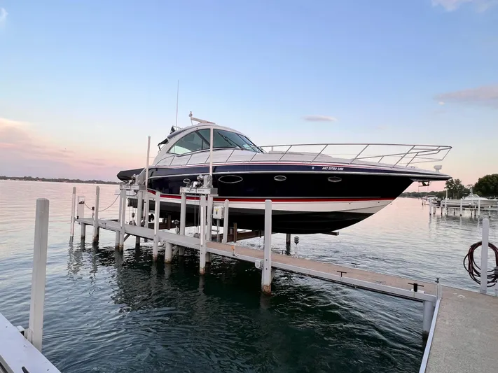 Our Seabatical Yacht Photos Pics 2014 Formula 45 Yacht on lift at sunset by the water.
