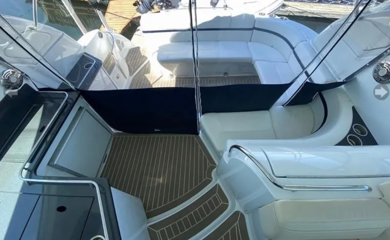 Our Seabatical Yacht Photos Pics Luxurious interior of a 2014 Formula 45 Yacht with white seating and wood flooring.