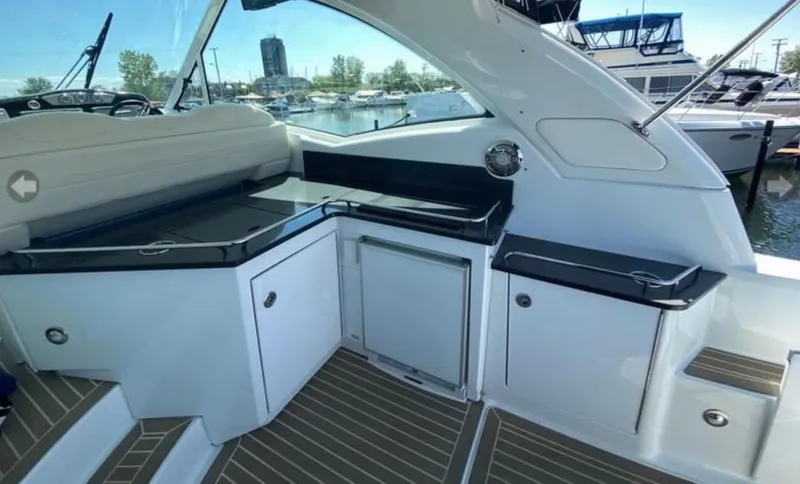 Our Seabatical Yacht Photos Pics 2014 Formula 45 Yacht interior with sleek cabinetry and seating, docked at a marina.