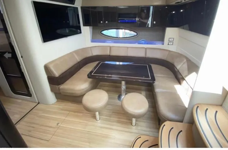 Our Seabatical Yacht Photos Pics Luxurious interior of 2014 Formula 45 Yacht with leather seating and wooden flooring.