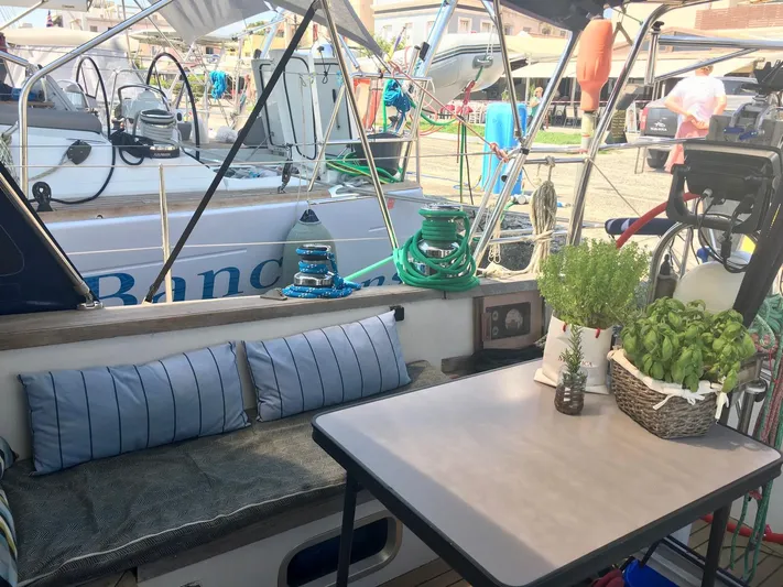  Yacht Photos Pics Cozy deck of 1990 Van De Stadt 44 Deck Saloon with seating and potted herbs.