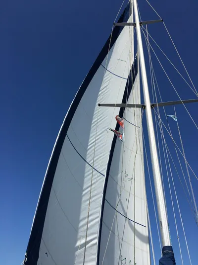  Yacht Photos Pics Sailing yacht Van De Stadt 44 Deck Saloon, 1990, with sails unfurled against a clear blue sky.