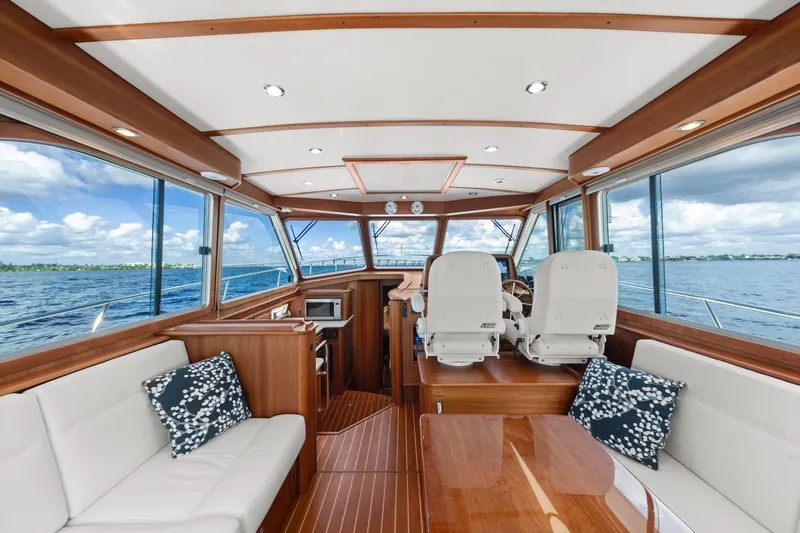 Balahula Yacht Photos Pics 2019 Sabre 45 Salon Express interior with elegant wood finish and ocean view.