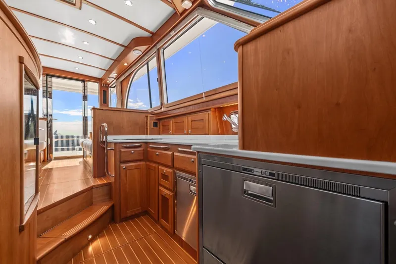 Balahula Yacht Photos Pics Luxurious interior of 2019 Sabre 45 Salon Express yacht with wooden cabinetry and modern appliances.