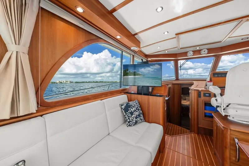Balahula Yacht Photos Pics 2019 Sabre 45 Salon Express interior with elegant wood finish and scenic ocean view.