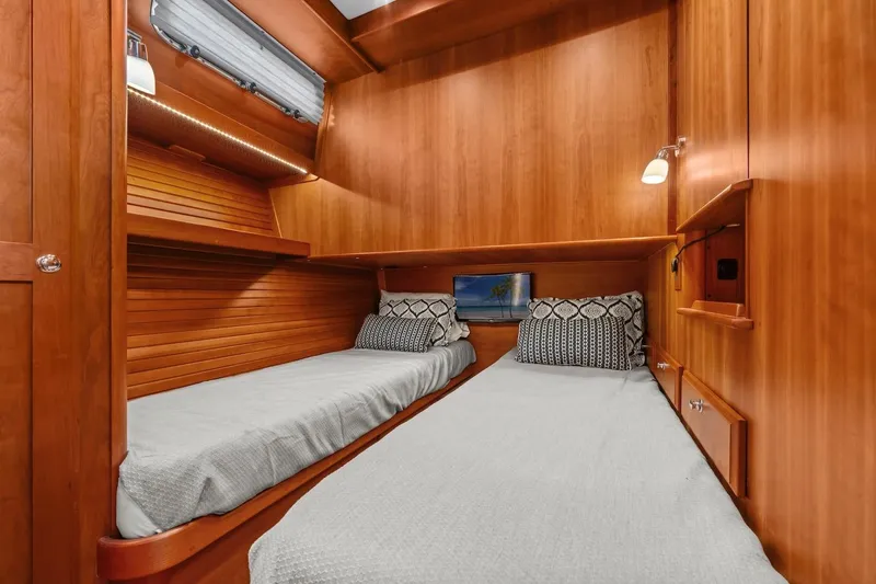 Balahula Yacht Photos Pics 2019 Sabre 45 Salon Express cabin with twin beds, wooden interior, and modern lighting.