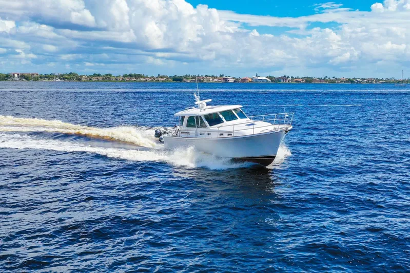 Balahula Yacht Photos Pics 2019 Sabre 45 Salon Express cruising on open blue waters under a partly cloudy sky.