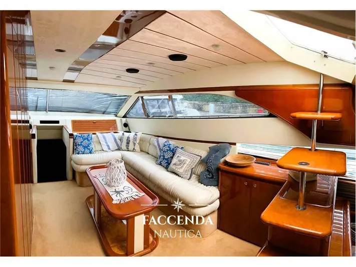  Yacht Photos Pics Luxurious interior of 1999 Ferretti Yachts 68 Anniversary with elegant seating and wooden accents.