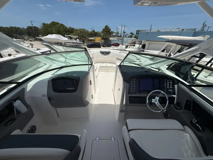 317-125 Yacht Photos Pics 2024 Robalo R317 Dual Console boat interior with modern dashboard and seating.