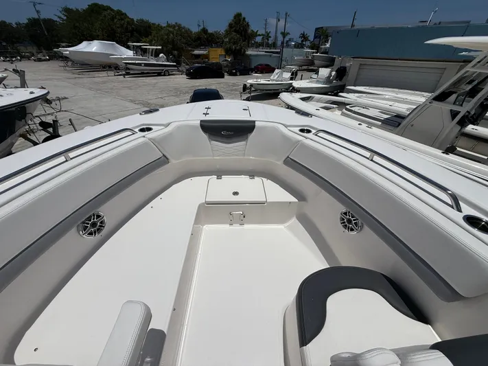 317-125 Yacht Photos Pics 2024 Robalo R317 Dual Console boat with spacious seating and sleek design in a marina.