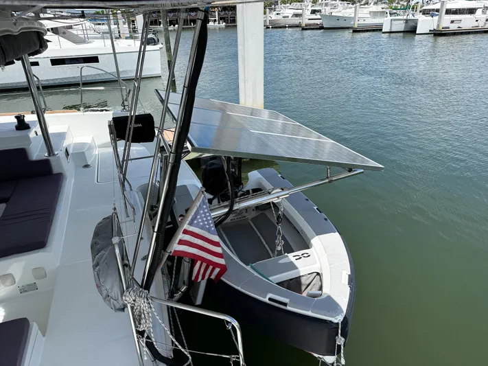 Escapist Yacht Photos Pics 2018 Lagoon 400 S2 catamaran docked with solar panels and American flag.