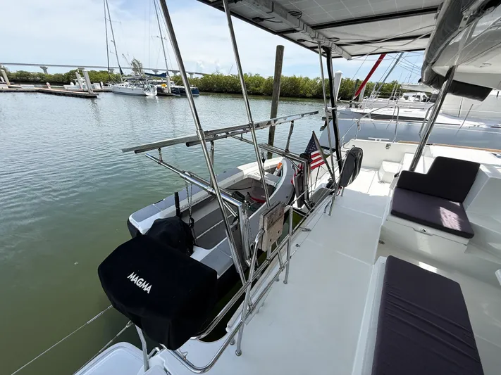 Escapist Yacht Photos Pics 2018 Lagoon 400 S2 catamaran docked, featuring spacious deck and seating area.