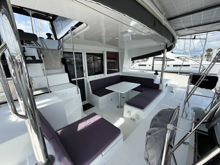 Escapist Yacht Photos Pics 2018 Lagoon 400 S2 catamaran with spacious outdoor seating and modern design.