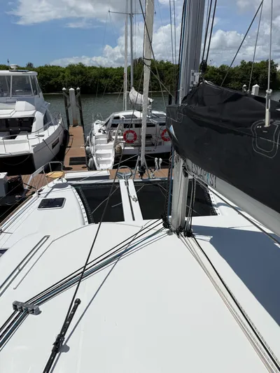 Escapist Yacht Photos Pics 2018 Lagoon 400 S2 catamaran docked at marina under clear skies.