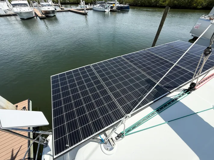 Escapist Yacht Photos Pics Solar panels on a 2018 Lagoon 400 S2 catamaran docked at a marina.
