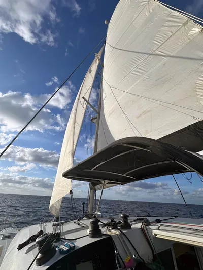 Escapist Yacht Photos Pics Sailing on a 2018 Lagoon 400 S2 catamaran under clear blue skies.