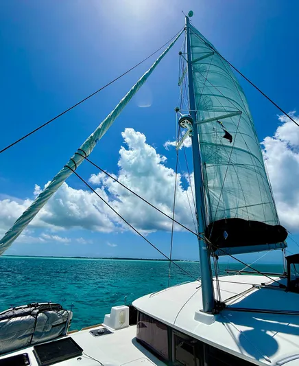 Escapist Yacht Photos Pics Sailing on a 2018 Lagoon 400 S2 catamaran under clear blue skies.