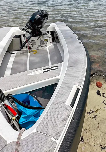 Escapist Yacht Photos Pics Inflatable boat with motor on sandy shore, Lagoon 400 S2, 2018 model.