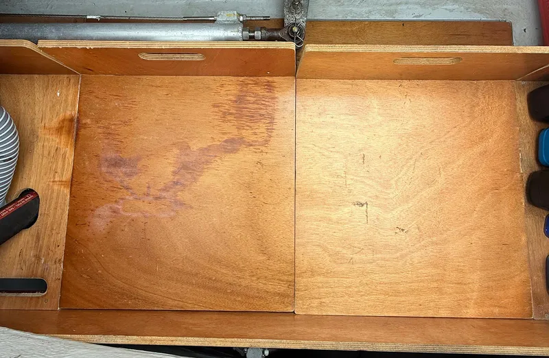 Escapist Yacht Photos Pics Wooden storage compartment in a 2018 Lagoon 400 S2 catamaran.