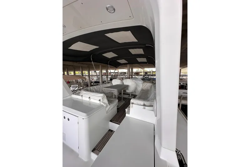 Dove Yacht Photos Pics 2015 Beneteau Swift Trawler 50 interior with covered seating and modern design.