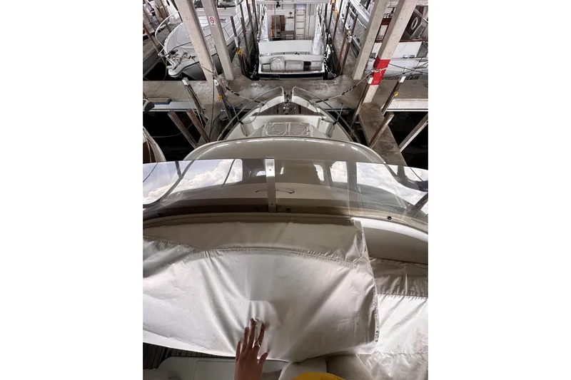 Dove Yacht Photos Pics 2015 Beneteau Swift Trawler 50 docked in a marina, viewed from above.