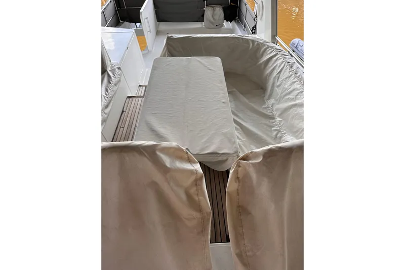 Dove Yacht Photos Pics Covered seating area on a 2015 Beneteau Swift Trawler 50 yacht deck.