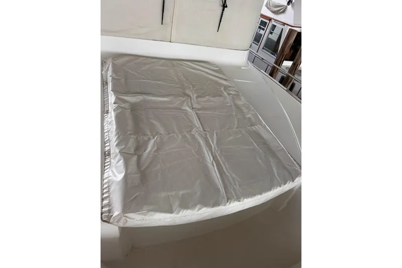 Dove Yacht Photos Pics 2015 Beneteau Swift Trawler 50 deck with protective cover.