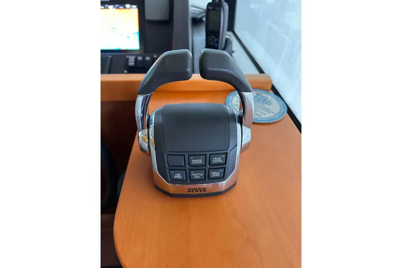 Dove Yacht Photos Pics Throttle control panel on 2015 Beneteau Swift Trawler 50, featuring various operational buttons.