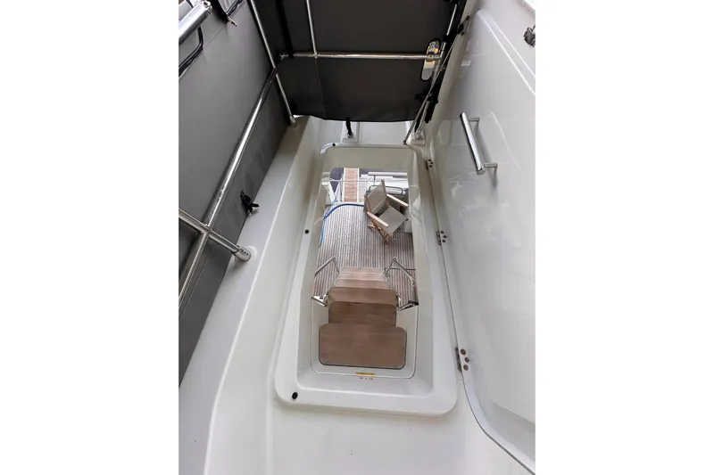 Dove Yacht Photos Pics 2015 Beneteau Swift Trawler 50 interior stairs and deck view.