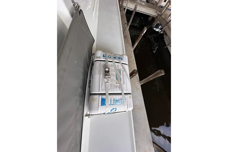 Dove Yacht Photos Pics 2015 Beneteau Swift Trawler 50 with secured life raft on deck.