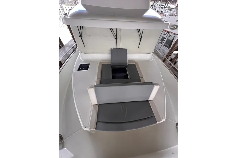 Dove Yacht Photos Pics 2015 Beneteau Swift Trawler 50, featuring a sleek deck with cushioned seating.