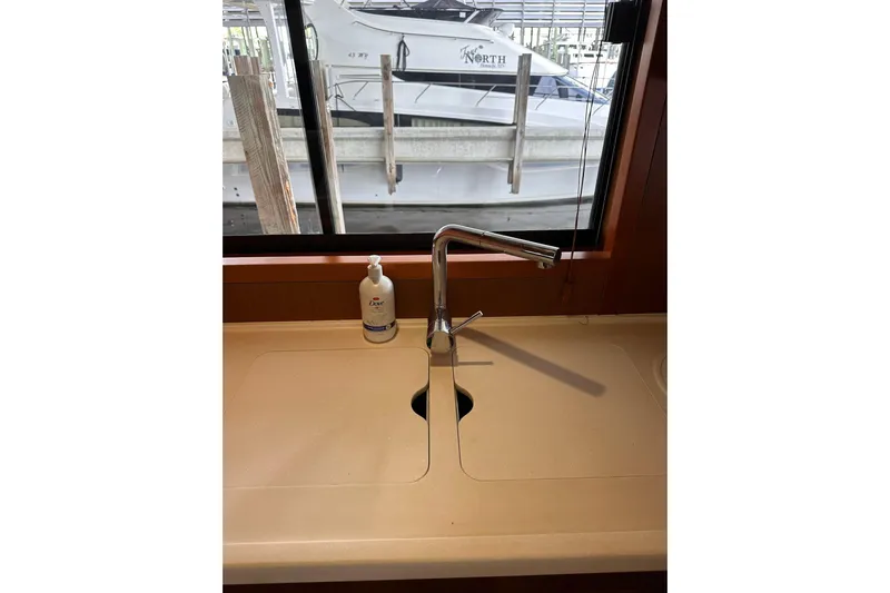 Dove Yacht Photos Pics 2015 Beneteau Swift Trawler 50 kitchen sink with faucet and soap dispenser.