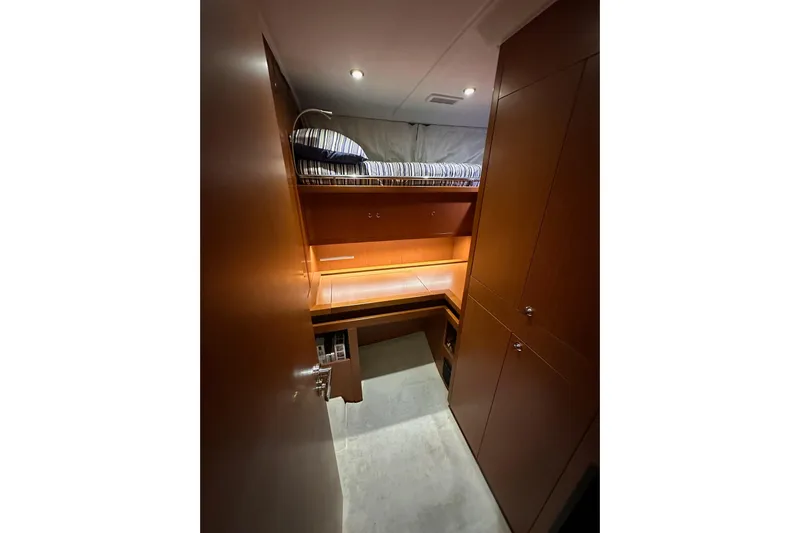 Dove Yacht Photos Pics 2015 Beneteau Swift Trawler 50 cabin interior with bunk bed and wooden cabinetry.