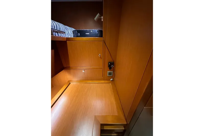 Dove Yacht Photos Pics 2015 Beneteau Swift Trawler 50 interior with wood finish and storage space.