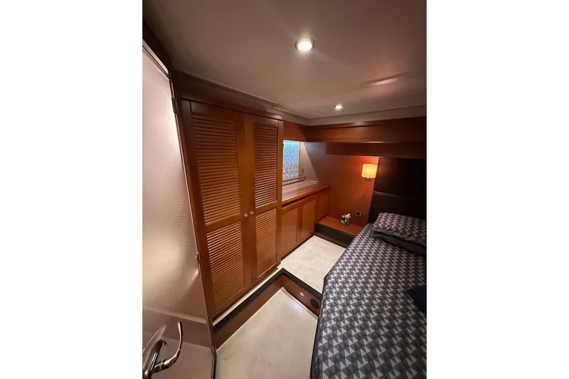 Dove Yacht Photos Pics 2015 Beneteau Swift Trawler 50 cabin interior with wood paneling and cozy lighting.