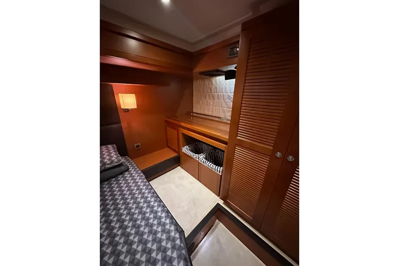 Dove Yacht Photos Pics 2015 Beneteau Swift Trawler 50 cabin interior with wood finish and cozy lighting.
