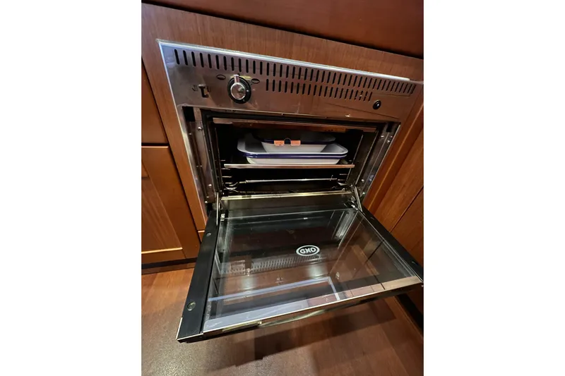 Dove Yacht Photos Pics Open oven in 2015 Beneteau Swift Trawler 50 kitchen, showcasing modern design.