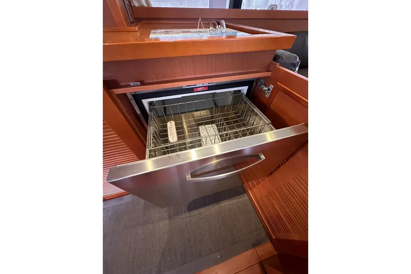 Dove Yacht Photos Pics Open dishwasher drawer in 2015 Beneteau Swift Trawler 50 yacht kitchen.