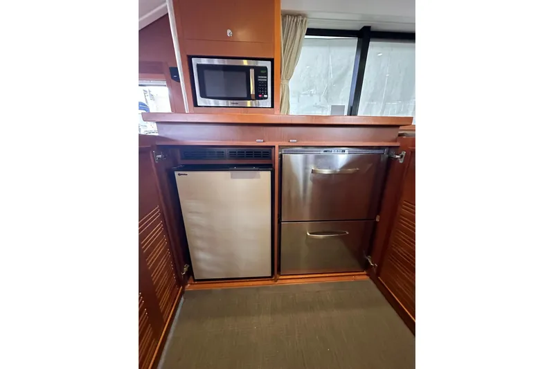 Dove Yacht Photos Pics Galley of 2015 Beneteau Swift Trawler 50 with microwave, fridge, and dishwasher.