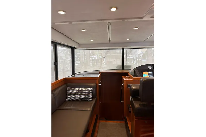 Dove Yacht Photos Pics Interior of 2015 Beneteau Swift Trawler 50 with modern seating and navigation area.