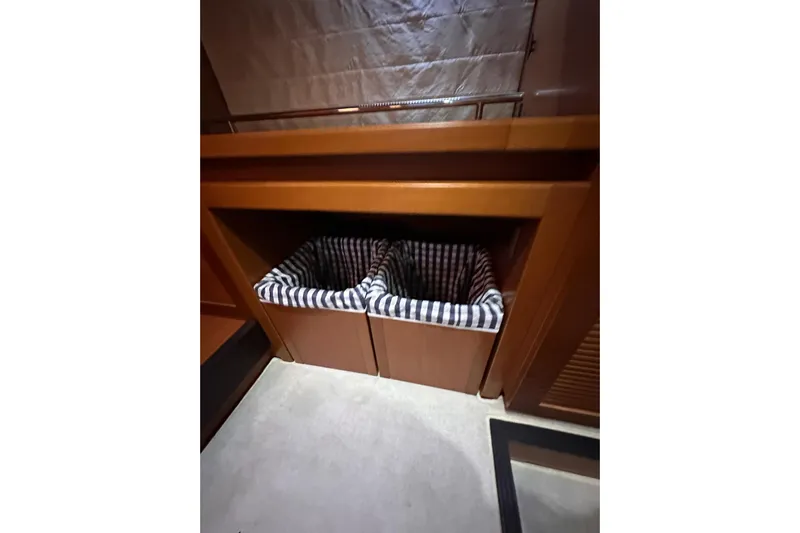 Dove Yacht Photos Pics Interior storage bins on 2015 Beneteau Swift Trawler 50, featuring striped liners.