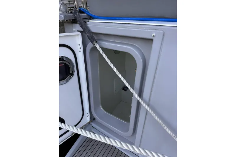 Dove Yacht Photos Pics Open hatch on 2015 Beneteau Swift Trawler 50, showcasing storage compartment.